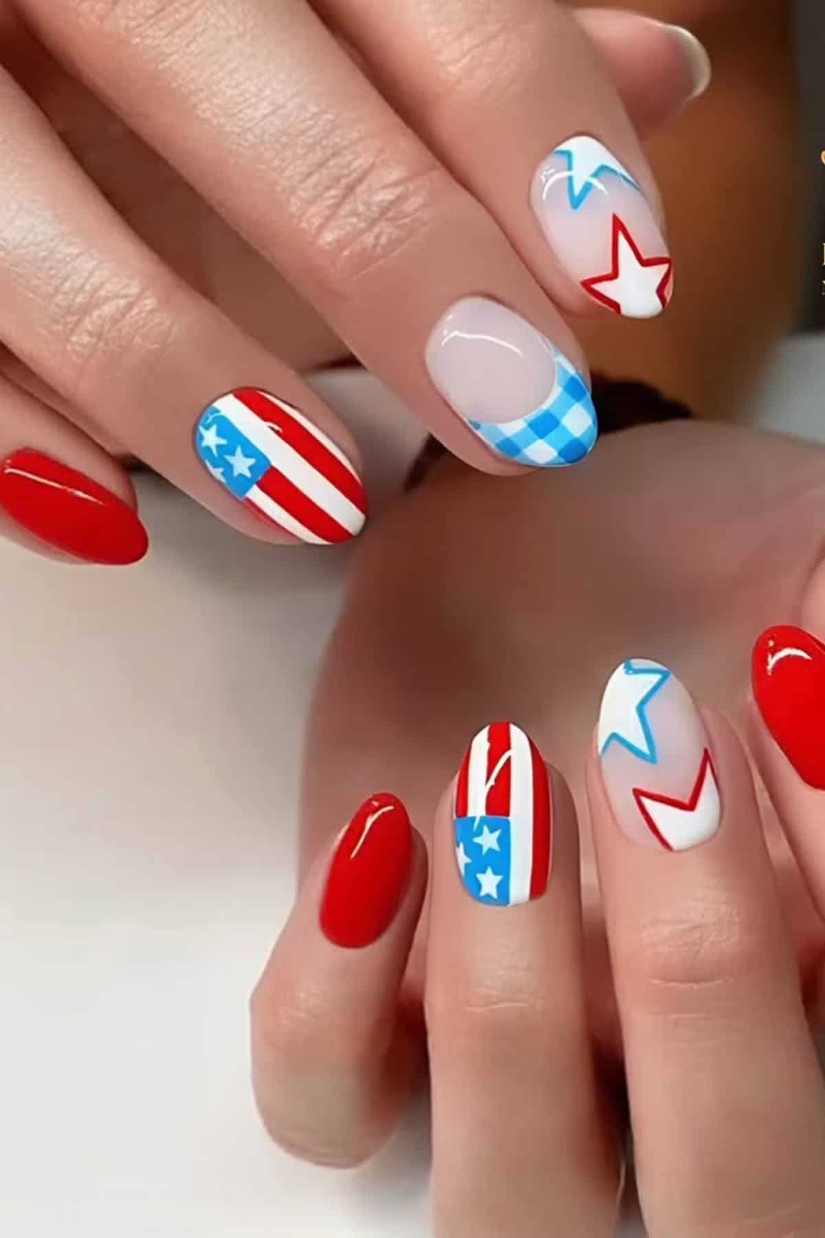 Hands with manicured nails featuring red, white, and blue designs, including stars, stripes, and checked patterns, inspired by the American flag.