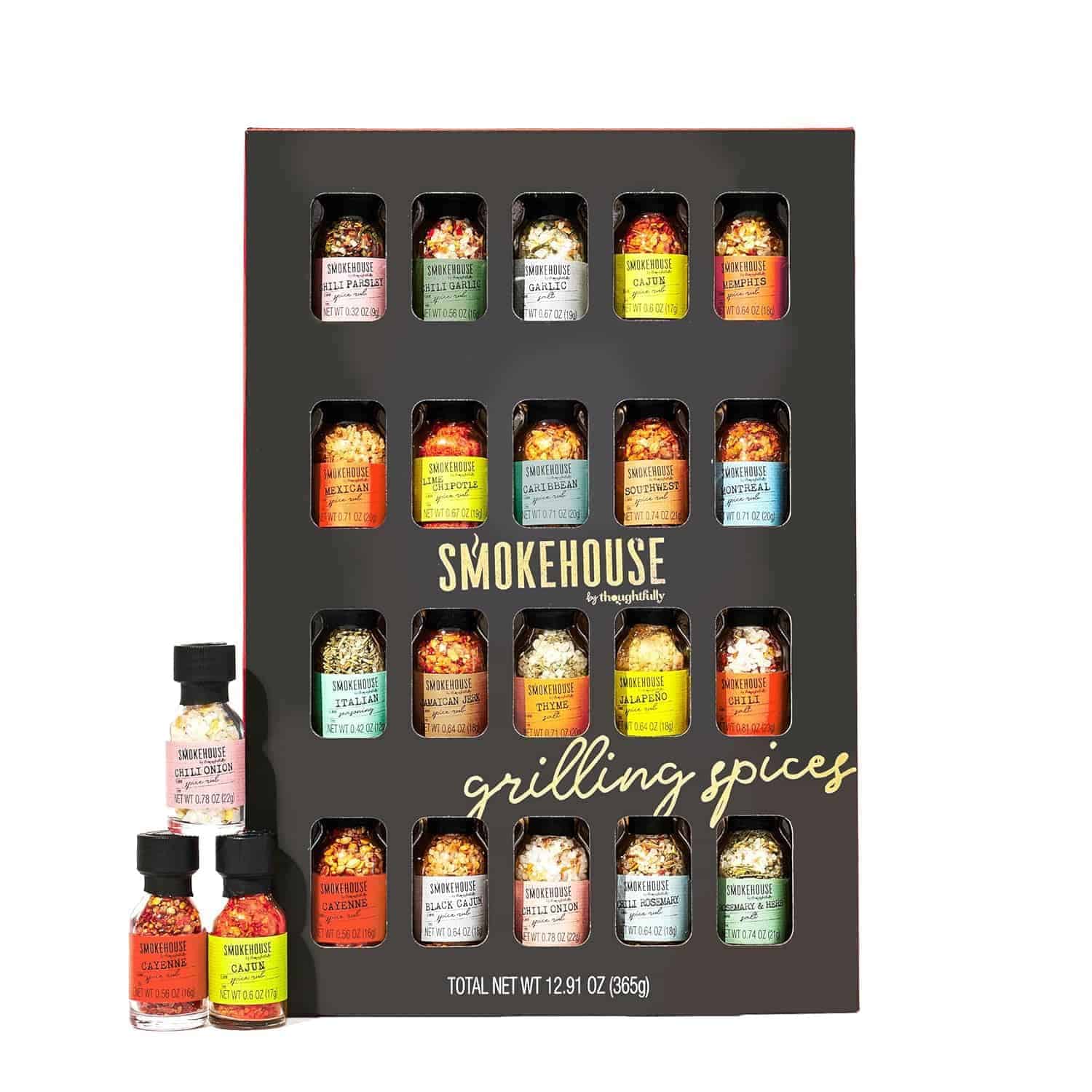 A boxed set of 20 small glass jars of grilling spices labeled "Smokehouse grilling spices," with three jars positioned in front of the box.