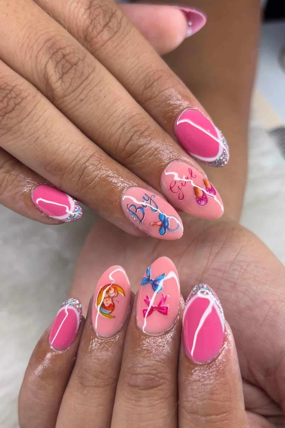Hands with almond-shaped pink nails featuring silver glitter tips and colorful cartoon-style designs, including bows, hearts, and teddy bears, on a neutral background.