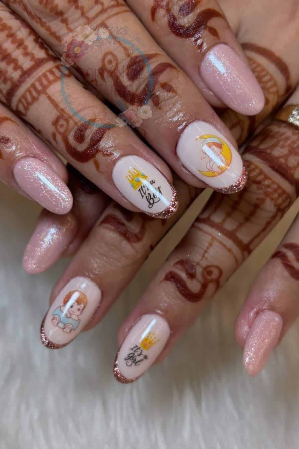 Hands with henna designs showing manicured nails featuring light pink polish, glitter tips, and nail art of cartoon characters and text.