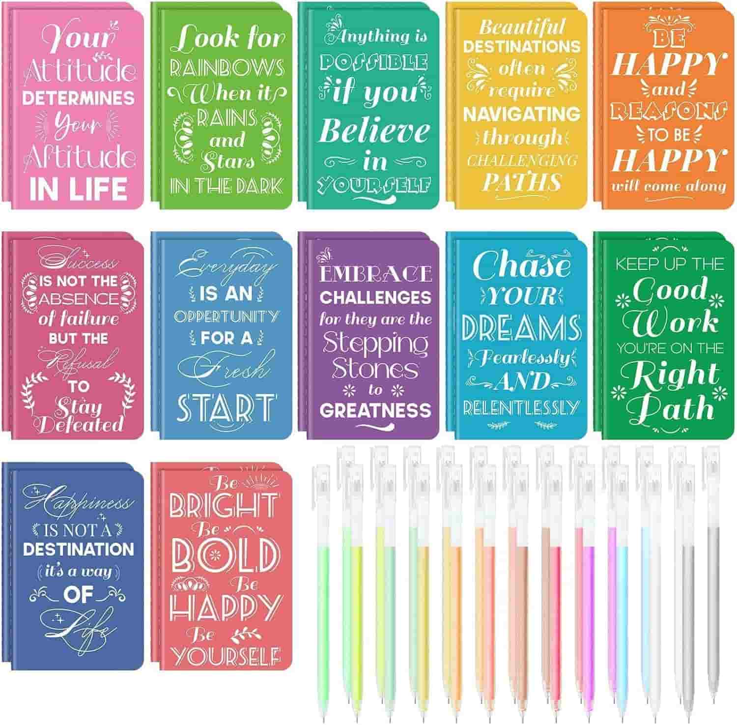 A set of colorful motivational quote cards arranged in rows above a line of multicolored gel pens. Each card features a different inspirational message in decorative fonts.