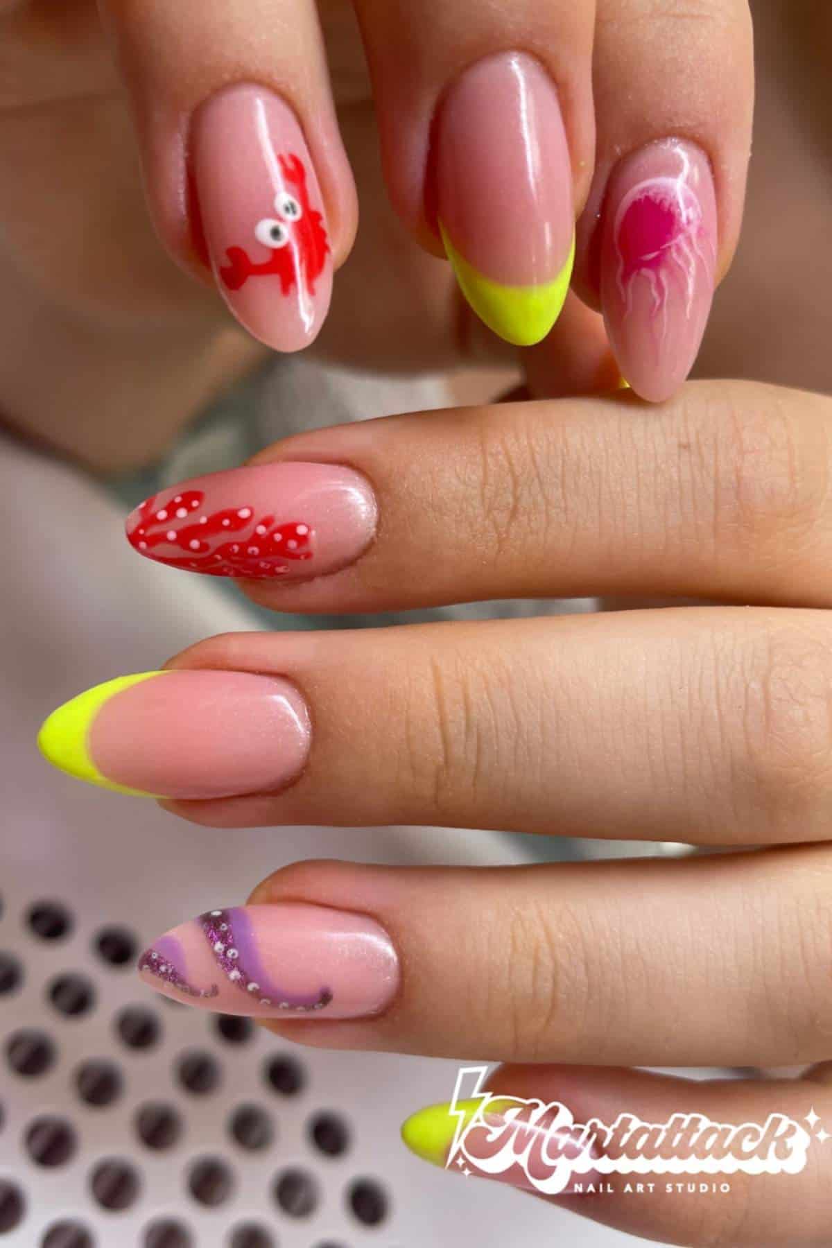 A hand with almond-shaped nails features neon yellow tips, red and purple sea-themed designs, and a jellyfish illustration; "Mortaliack Nail Art Studio" logo is visible.