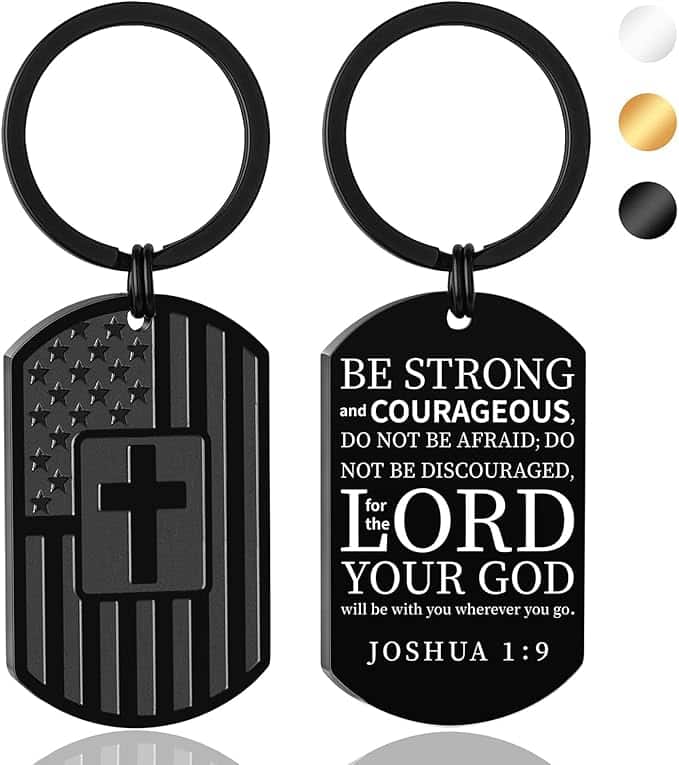 Two black keychains: one with a U.S. flag and cross design, the other with the Joshua 1:9 Bible verse in white lettering. Three color options shown in circles at the top right.