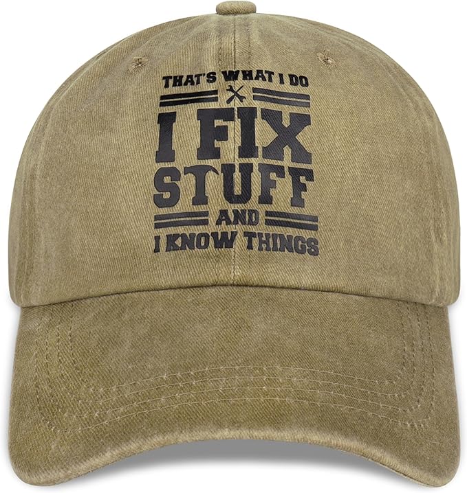 A khaki baseball cap with the text "THAT'S WHAT I DO I FIX STUFF AND I KNOW THINGS" printed in black on the front.
