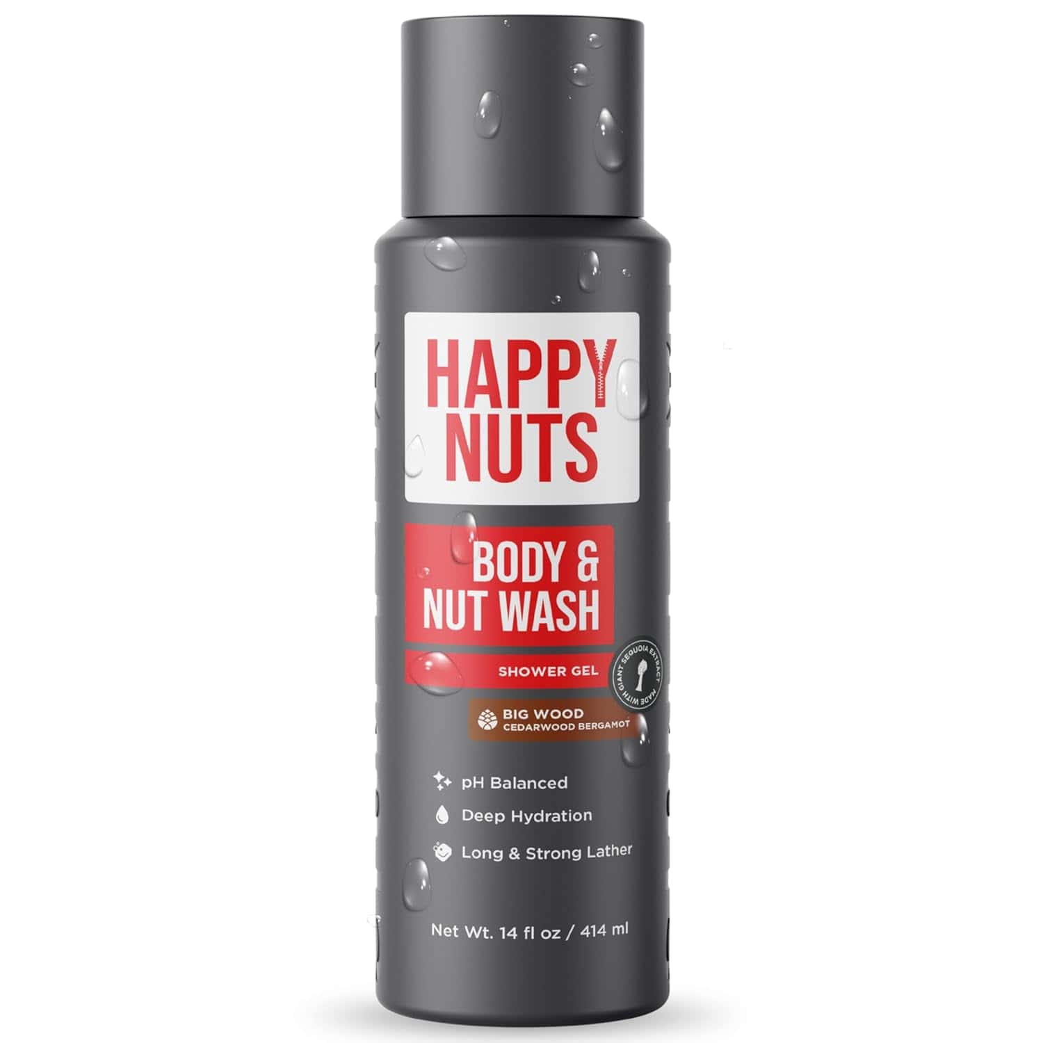 A bottle of Happy Nuts Body & Nut Wash shower gel, labeled “Big Wood Cedarwood Reserve,” with water droplets on the surface. The bottle is 14 fl oz (414 ml).