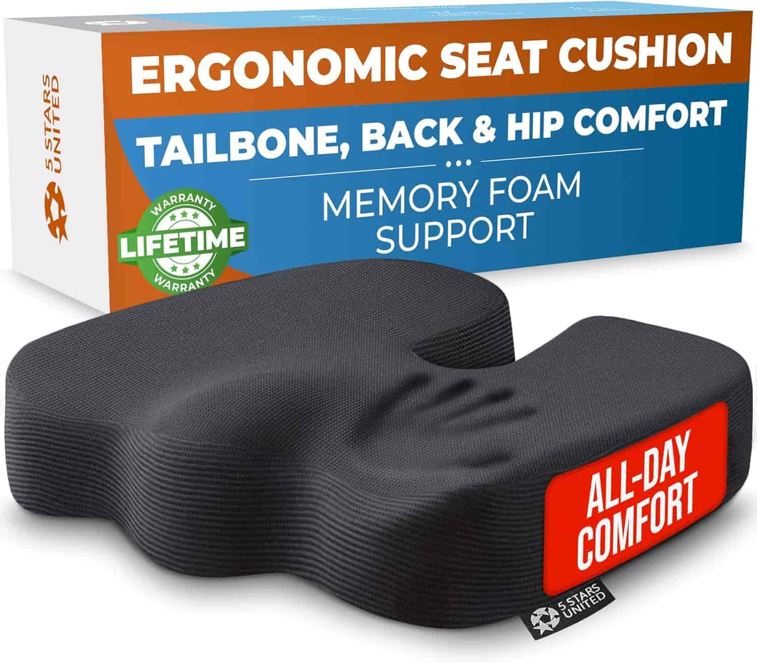 Black ergonomic seat cushion for tailbone, back, and hip comfort with "ALL-DAY COMFORT" label, shown in front of its packaging highlighting memory foam and lifetime warranty.