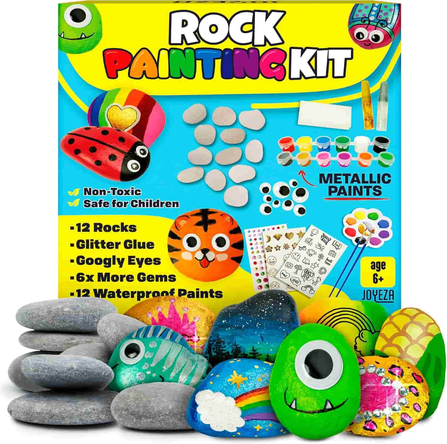 Rock painting kit with 12 plain rocks, paints, brushes, glitter glue, googly eyes, stickers, and decorated sample rocks in front of the colorful packaging.