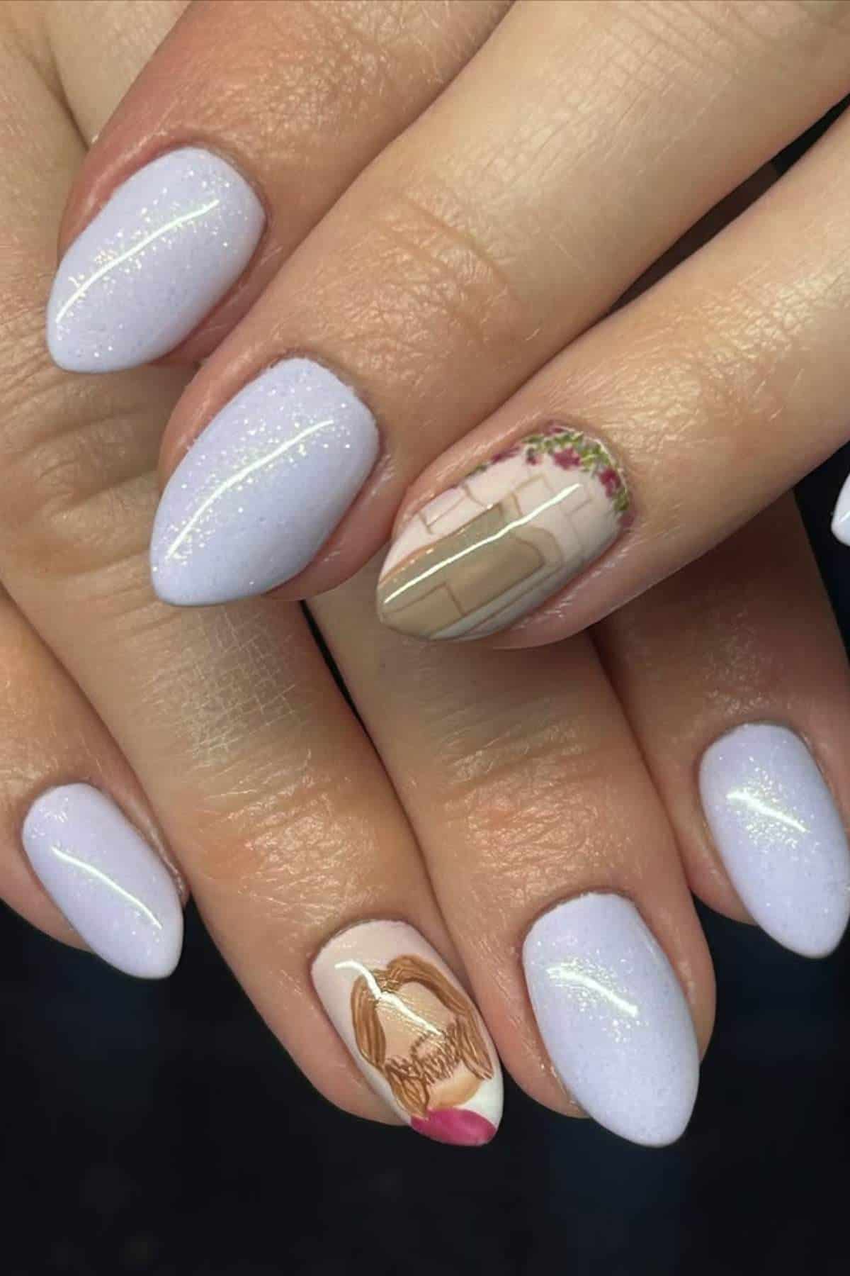 A hand with short, almond-shaped nails painted light lavender; two accent nails feature detailed art, one with a plaid design and flowers, the other with a braid and a pink bow.