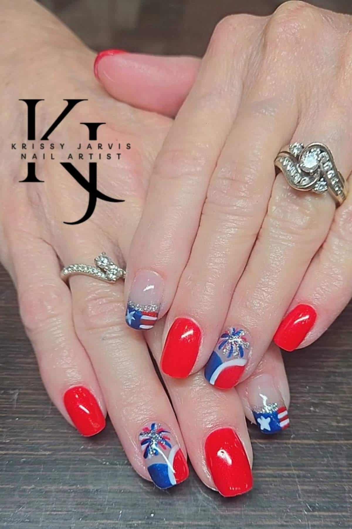Red, white, and blue patriotic nails with glitter accents.