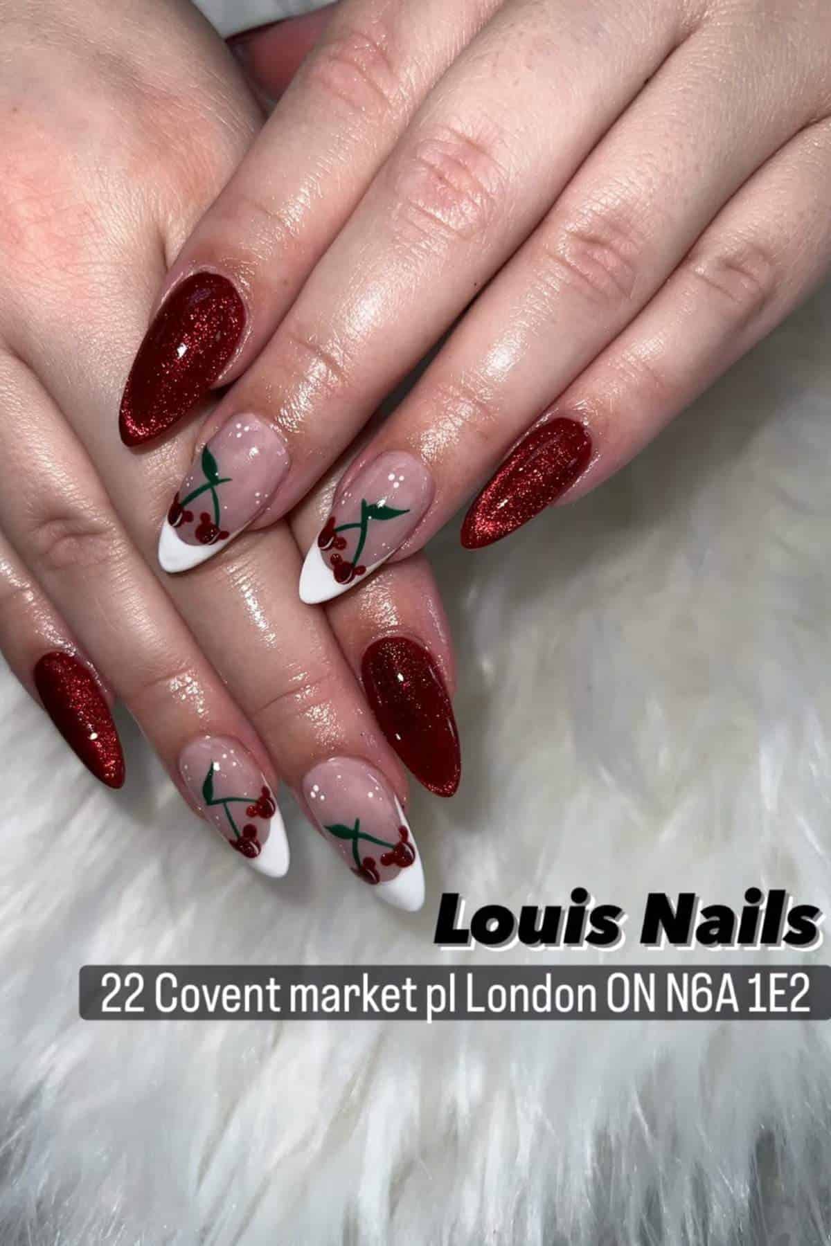 Hands with manicured nails featuring red glitter polish and cherry nail art accents. Text reads: "Louis Nails, 22 Covent market pl London ON N6A 1E2.