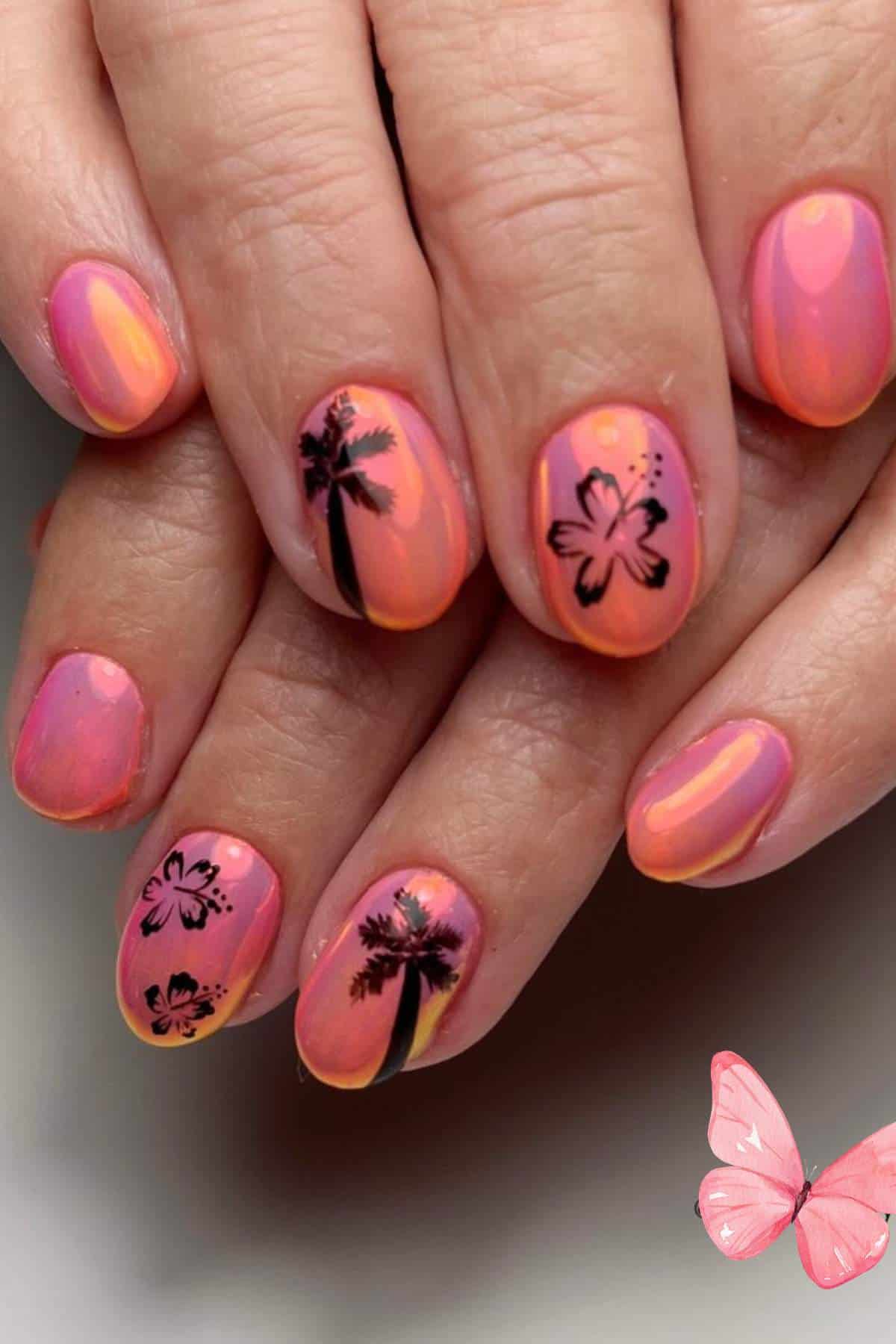 Hands with oval-shaped nails painted in pink and orange gradient, featuring black palm tree and hibiscus flower designs, with a small illustrated pink butterfly in the corner.