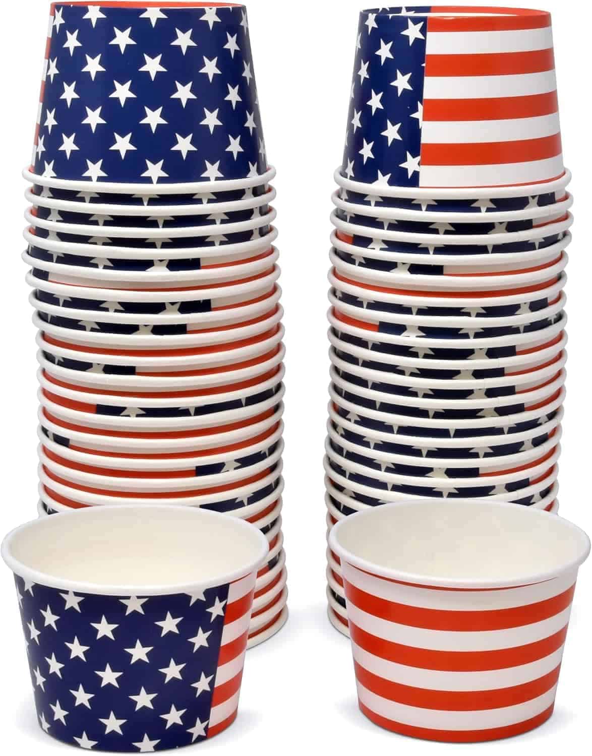 Stacks of paper cups with American flag designs; one stack features stars on blue, another features red and white stripes. Two additional cups are placed in front.