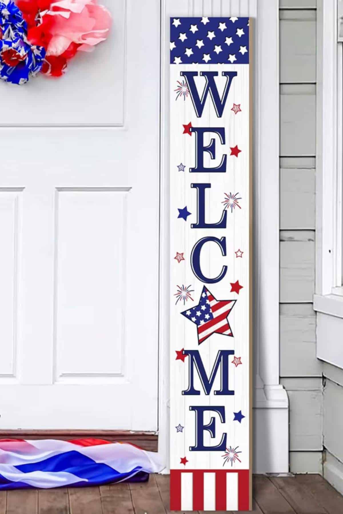 A vertical sign by a door reads "WELCOME" in blue letters with stars and stripes, featuring American flag motifs and patriotic decorations.