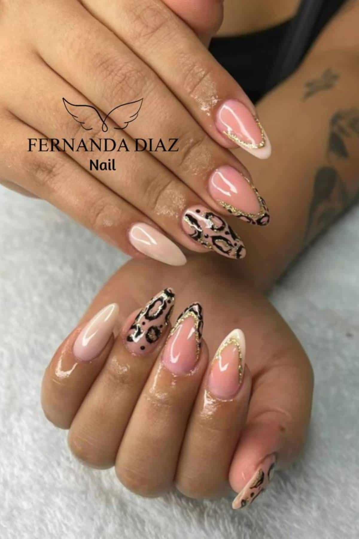 A set of manicured hands with almond-shaped nails featuring pink, nude, French tip, and leopard print designs.