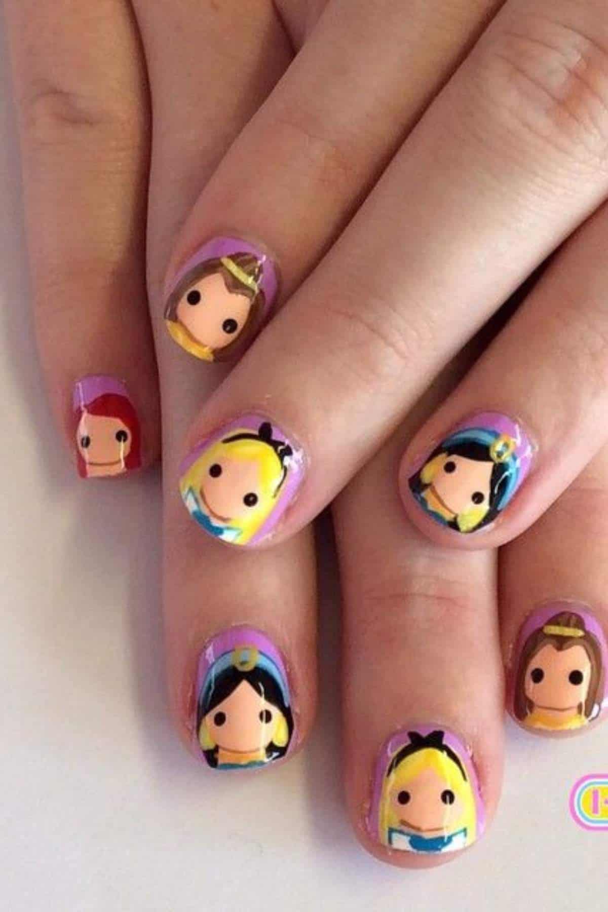 Fingernails painted with cartoon faces of various princesses in bright colors, shown on both hands against a neutral background.