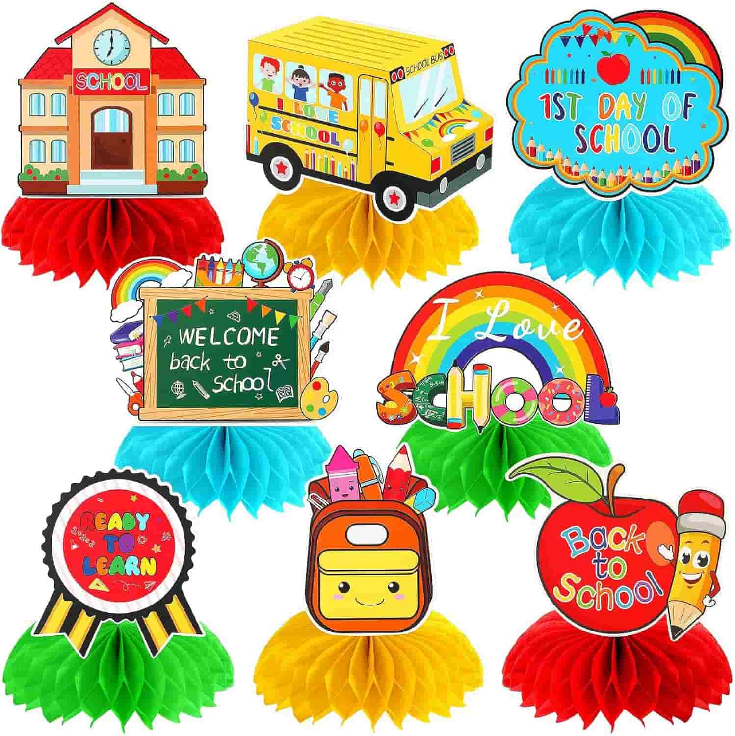 Colorful back-to-school themed decorations featuring a school building, school bus, chalkboard, rainbow, backpack, apple, and various school-related messages on tissue paper bases.