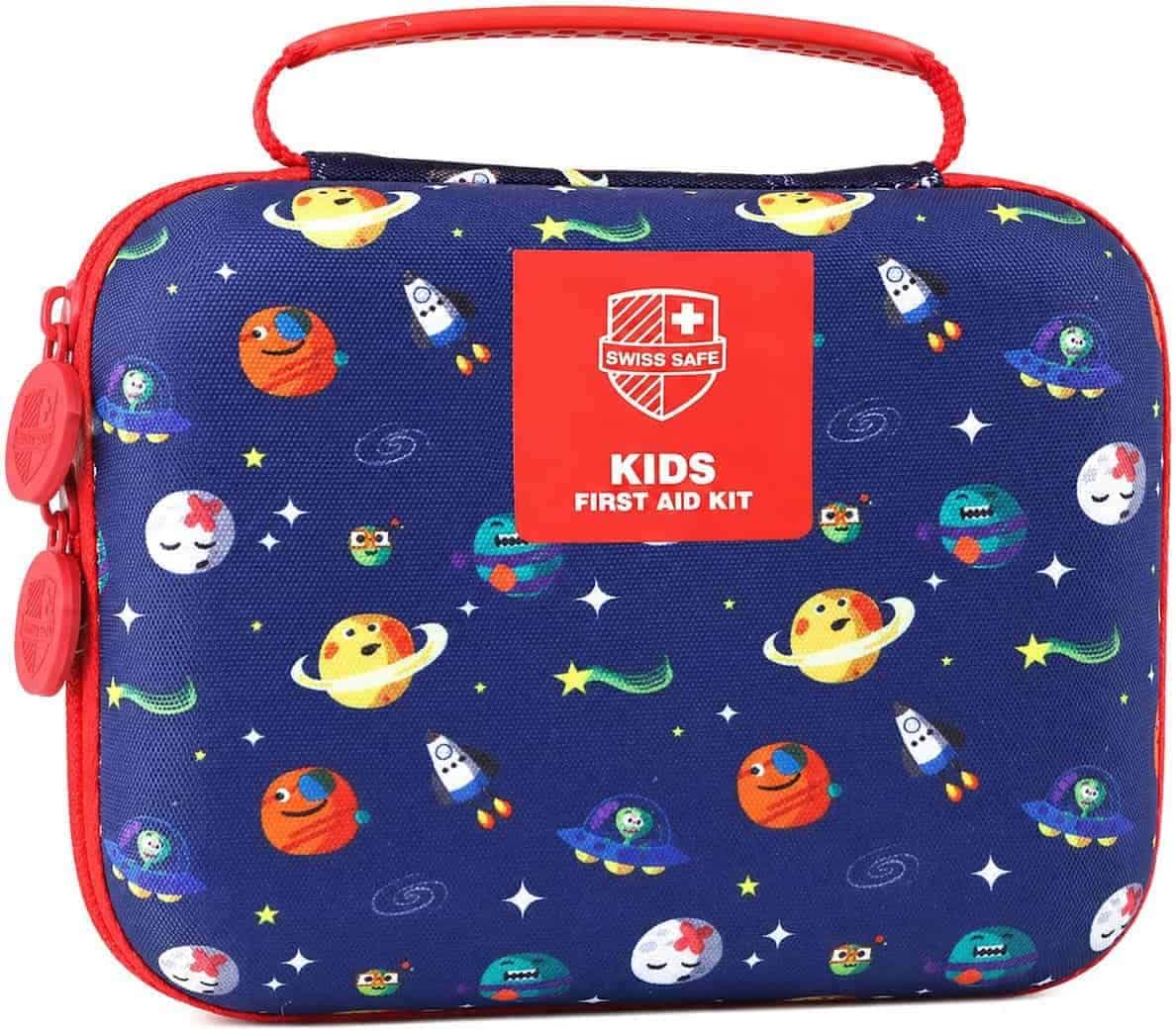 A blue, rectangular Swiss Safe kids’ first aid kit with a red handle, decorated with cartoon planets, rockets, and stars.