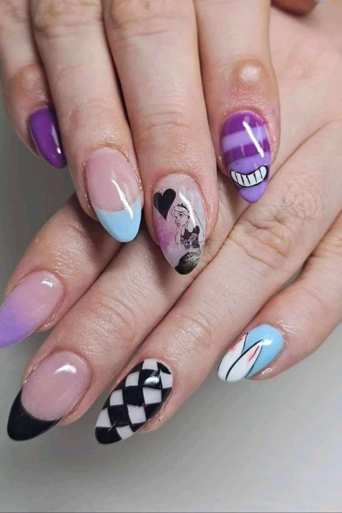 A hand with almond-shaped nails features colorful designs, including cartoon art, geometric patterns, hearts, and pastel color blocks on each nail.