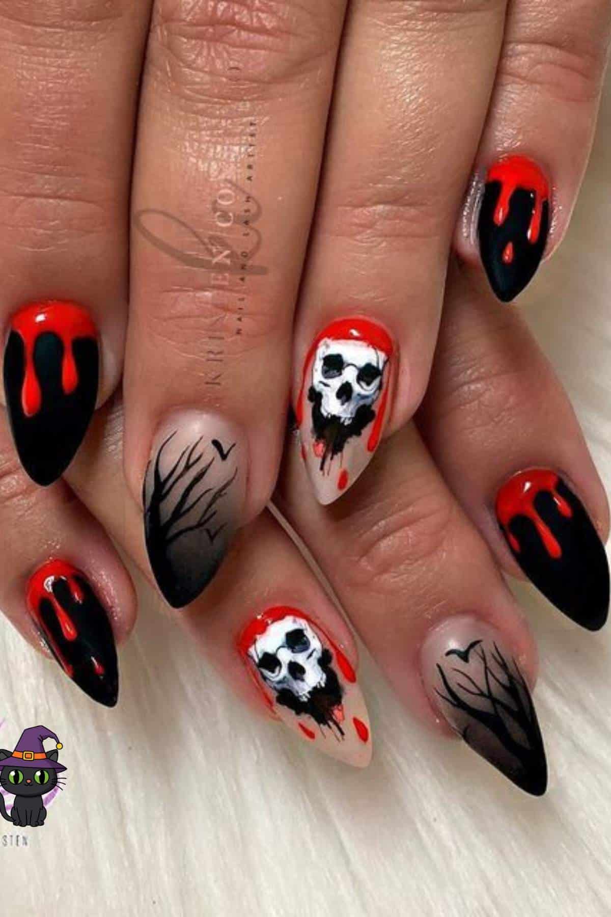 Hands with long, pointed nails featuring black and red drip designs, white skull faces, and black tree branch patterns on a white surface.