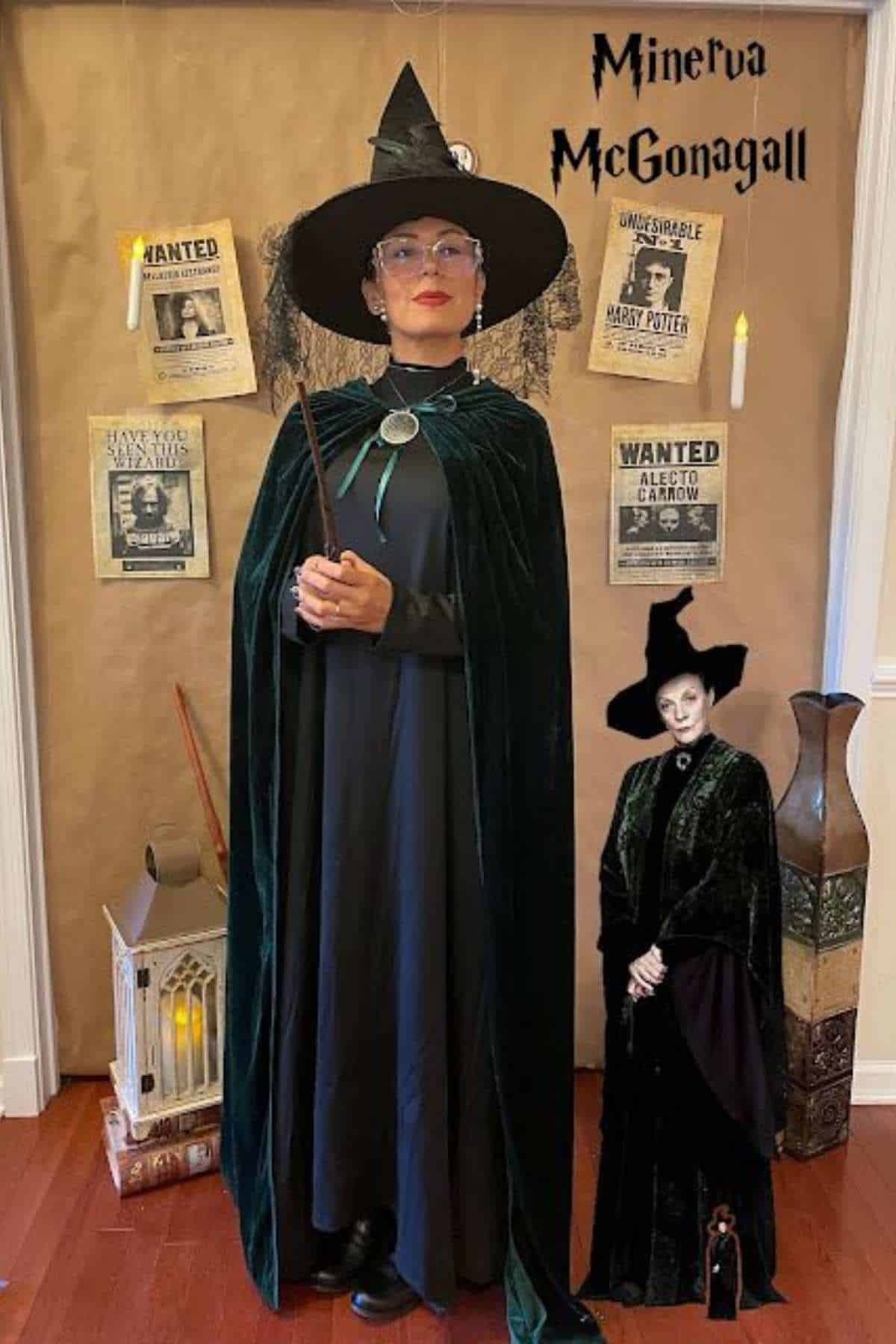 Person dressed as Professor Minerva McGonagall in a witch hat and cloak stands in front of Harry Potter-themed posters and decorations.