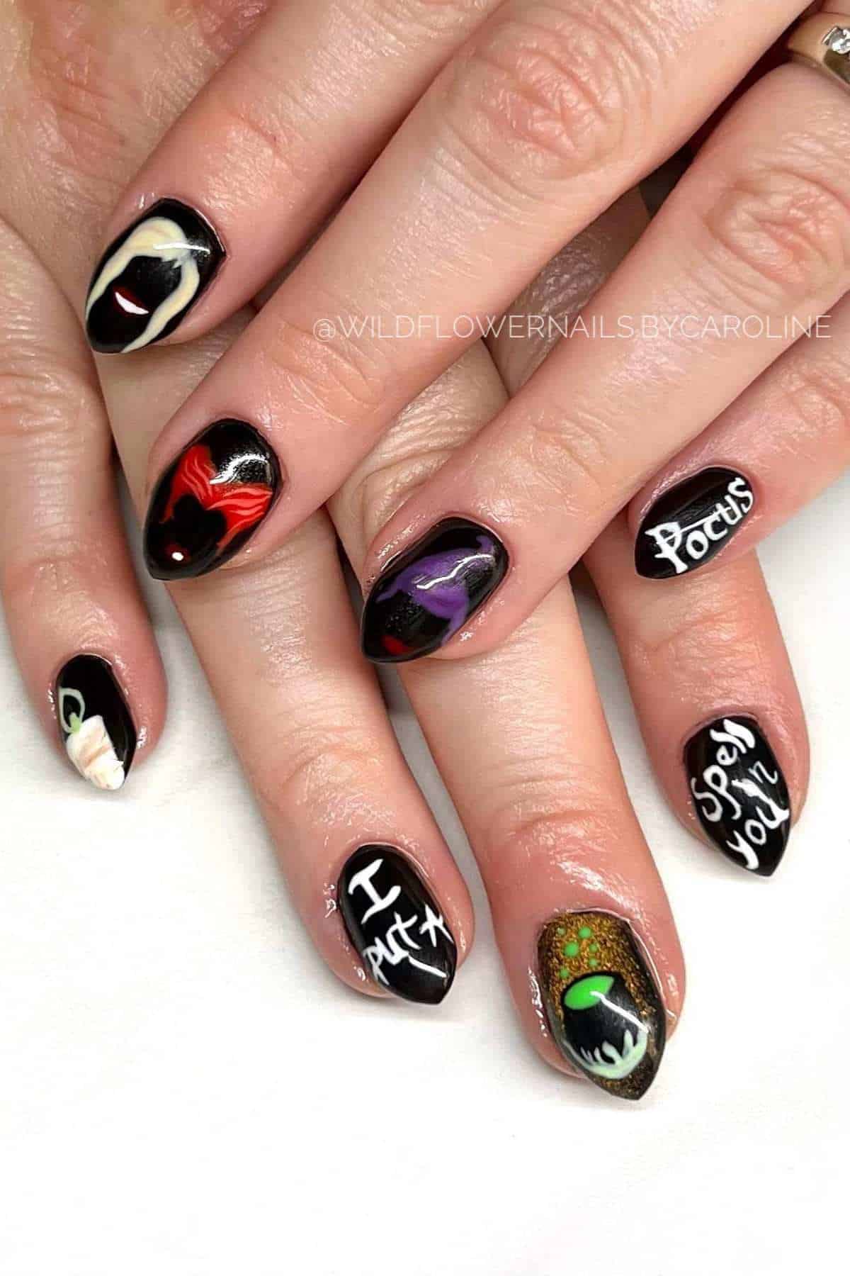 Hands with long, pointed nails featuring colorful “Hocus Pocus” themed designs, including characters, text, and symbols from the movie on a white background.