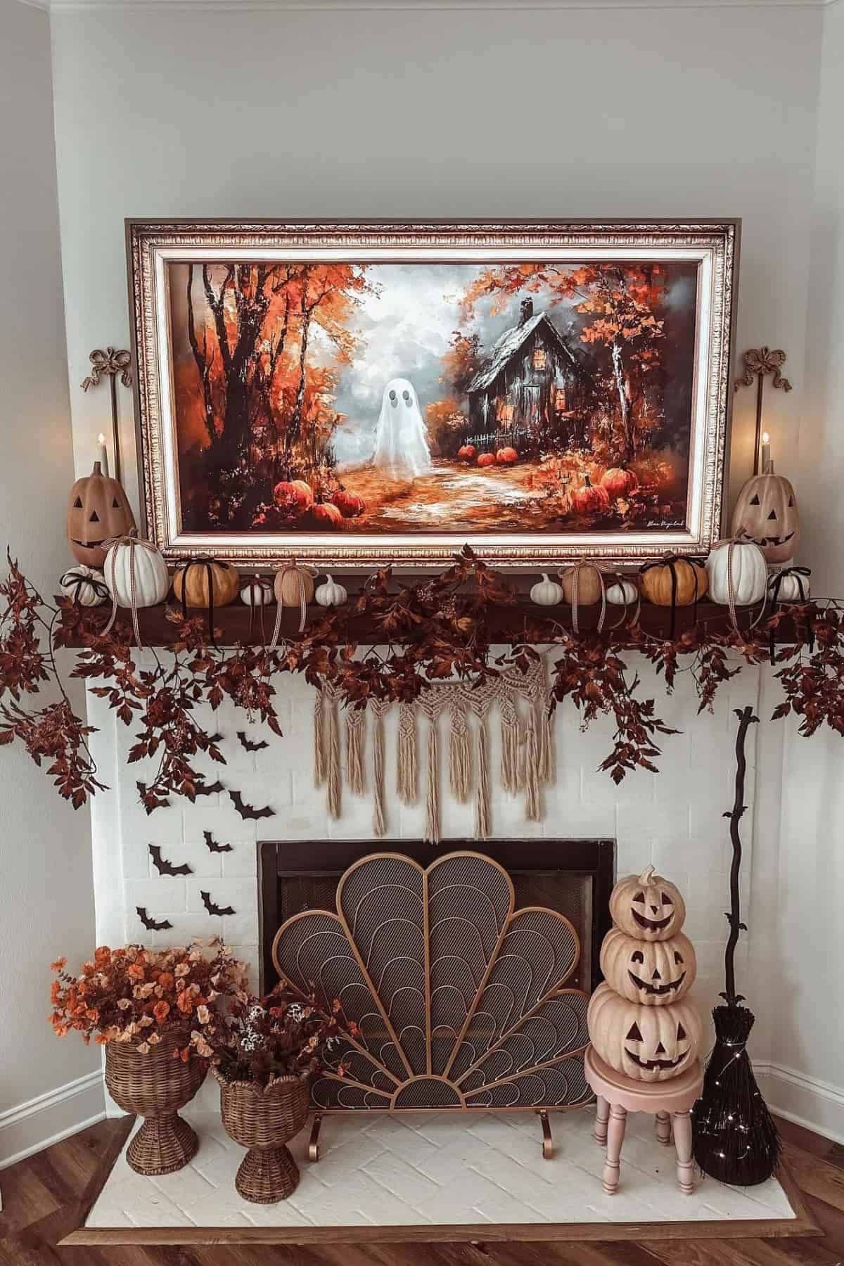 A decorated fireplace features carved pumpkins, autumn leaves, and a framed painting of a ghost in a fall landscape above the mantel.