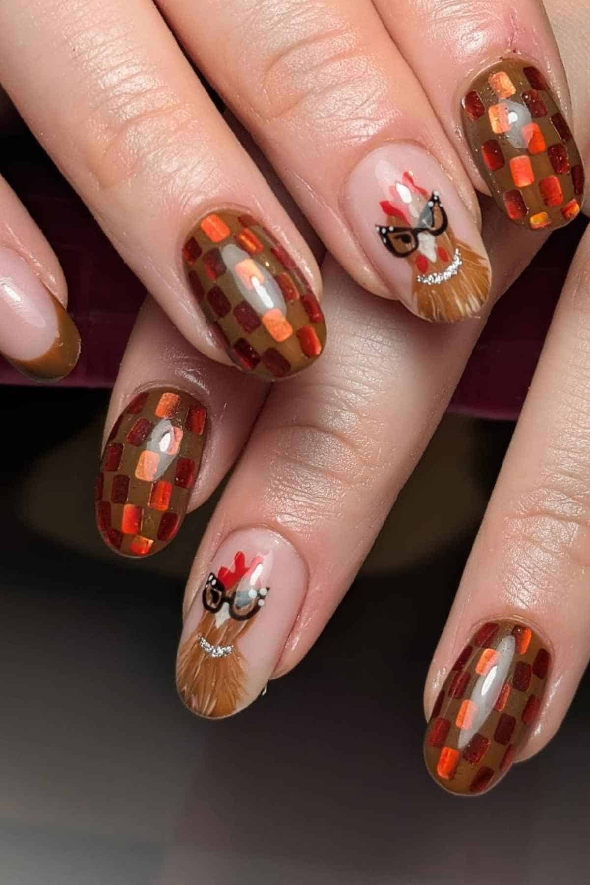 Manicure featuring alternating nails with a brown and orange checkered pattern and hand-painted turkeys wearing glasses.