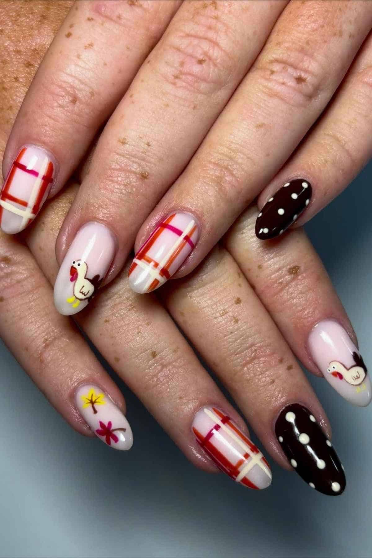 Manicured nails featuring Thanksgiving-themed nail art, including turkey illustrations, plaid patterns, polka dots, and autumn leaves.