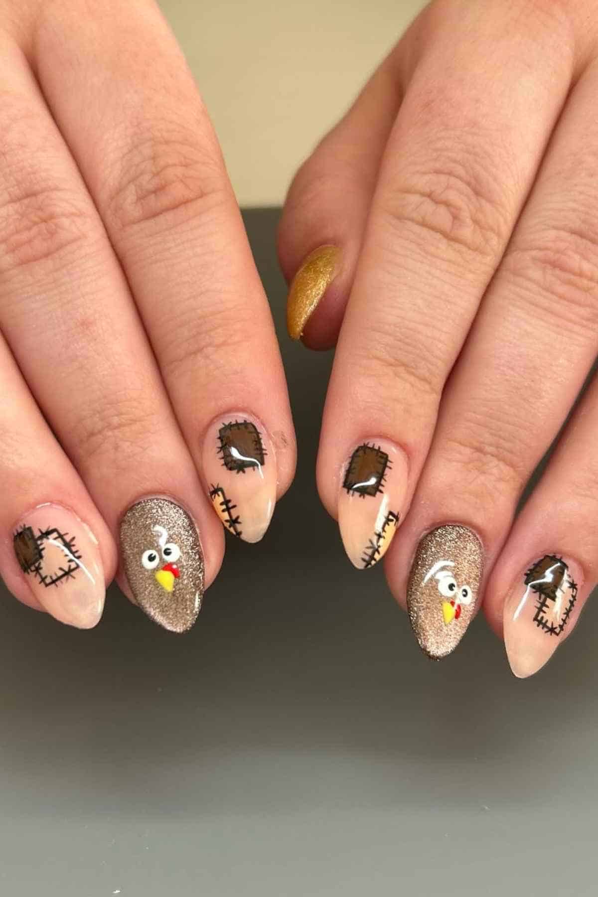 Manicured almond-shaped nails featuring turkey face designs and stitched fabric patch patterns.